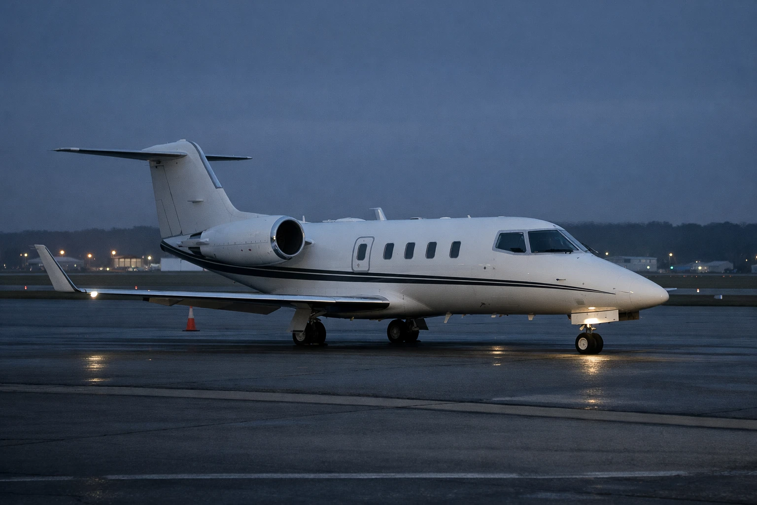 Learjet 55 on Regional Airport Ramp at Night-to-Dawn Learjet 55 business jet on an airport ramp in a night-to-dawn setting