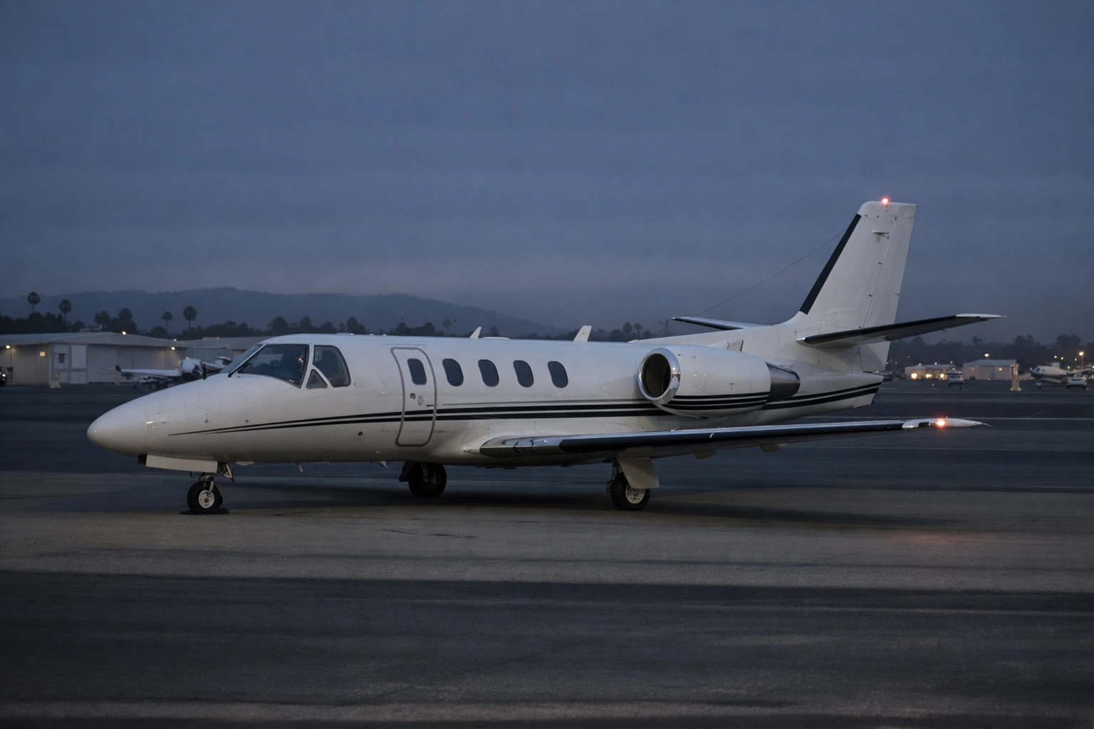Cessna Citation S550 on Executive Airport Ramp Near San Diego Cessna Citation S550 business jet on an executive airport ramp in a night-to-dawn setting