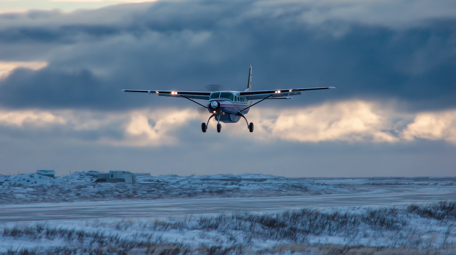 Bering Air Grand Caravan Near Nome Alaska Bering Air Cessna 208B Grand Caravan flying near Nome Alaska in winter conditions