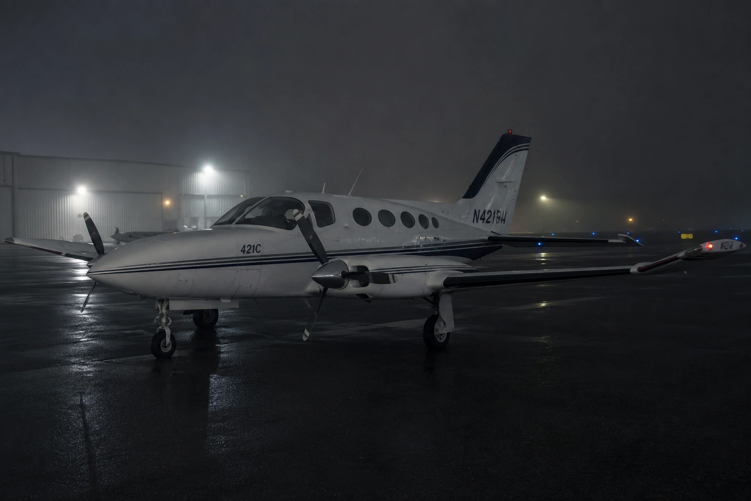 Cessna 421C Night IFR Icing Accident — Wimberley, Texas, April 2026 Twin-engine general aviation aircraft on a rain-wet tarmac at night with overcast low-visibility conditions in the background